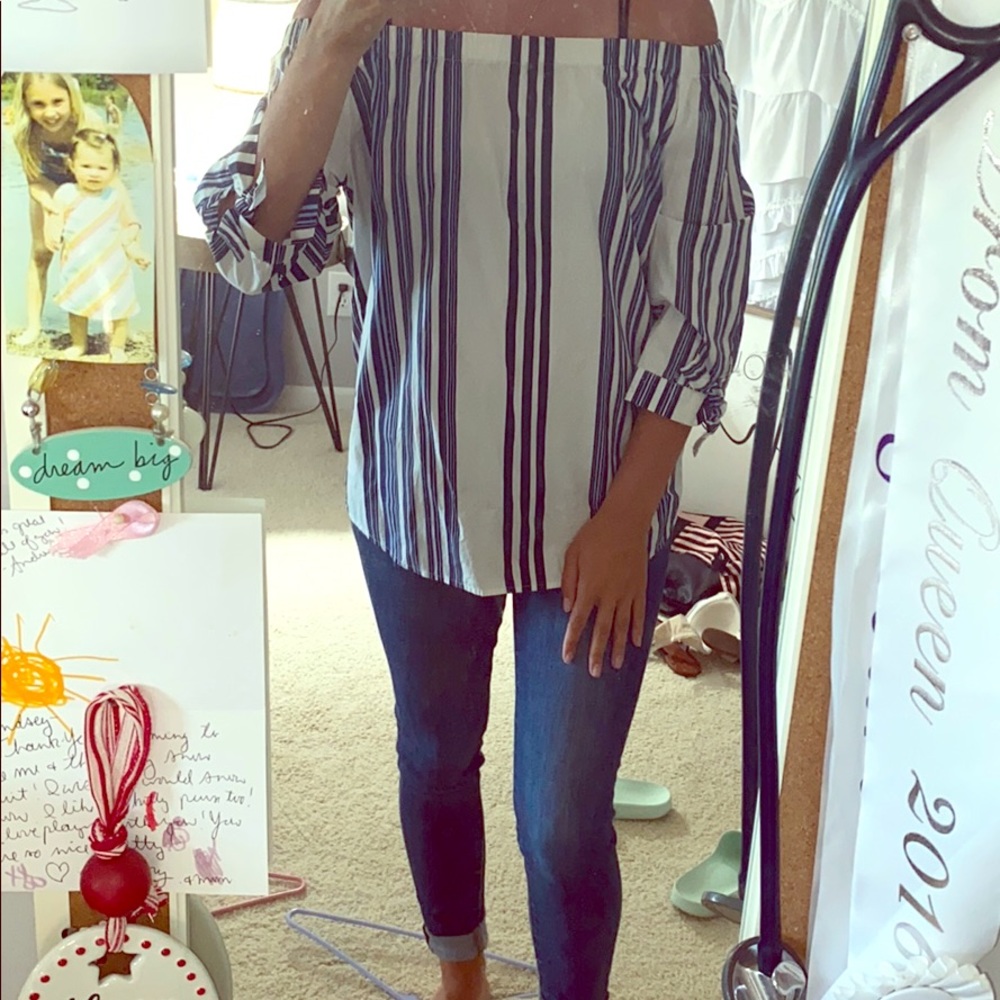 Multiple navy stripes on off the shoulder top.